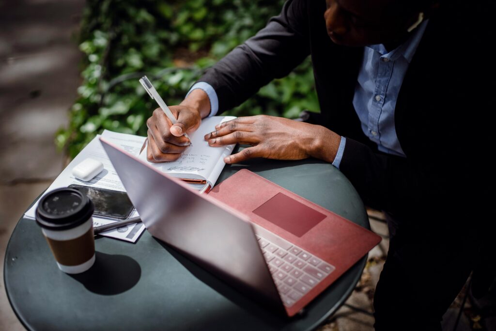 A man in his late 30s works from home, exploring career and financial reinvention.