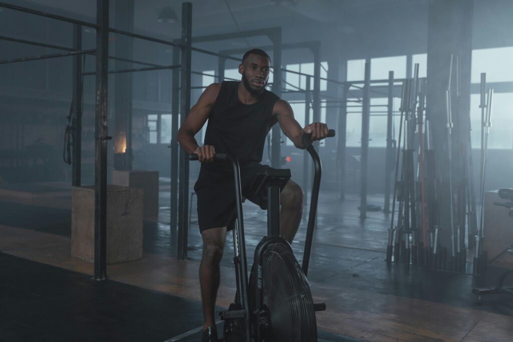 Middle-aged man working out in a gym to rebuild physical and mental strength after life setbacks.