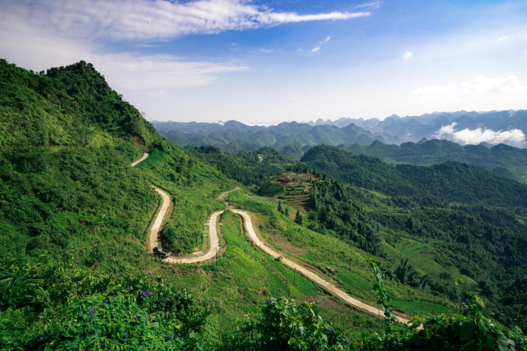 A winding road through the mountains representing life’s challenges and resilience.
