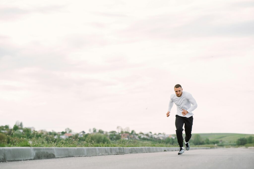 Man running on road at sunrise symbolizing a fresh start after 35